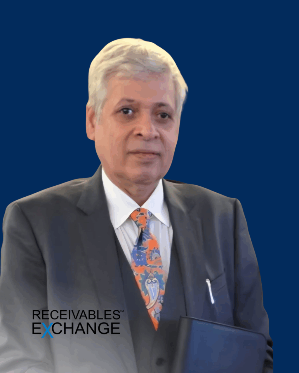 Professional portrait of a man in a dark suit with a colorful tie, holding a blue folder, against a blue background featuring the Receivables Exchange logo.